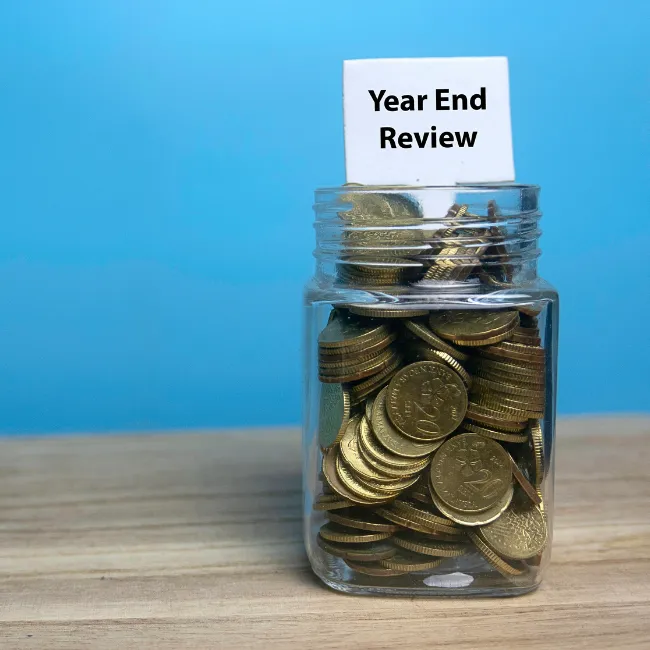  A clean workspace with a savings jar labeled "Future Goals"