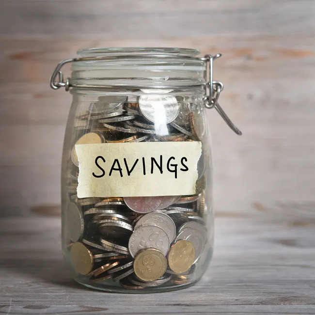 A savings jar labeled 'Future Goals'